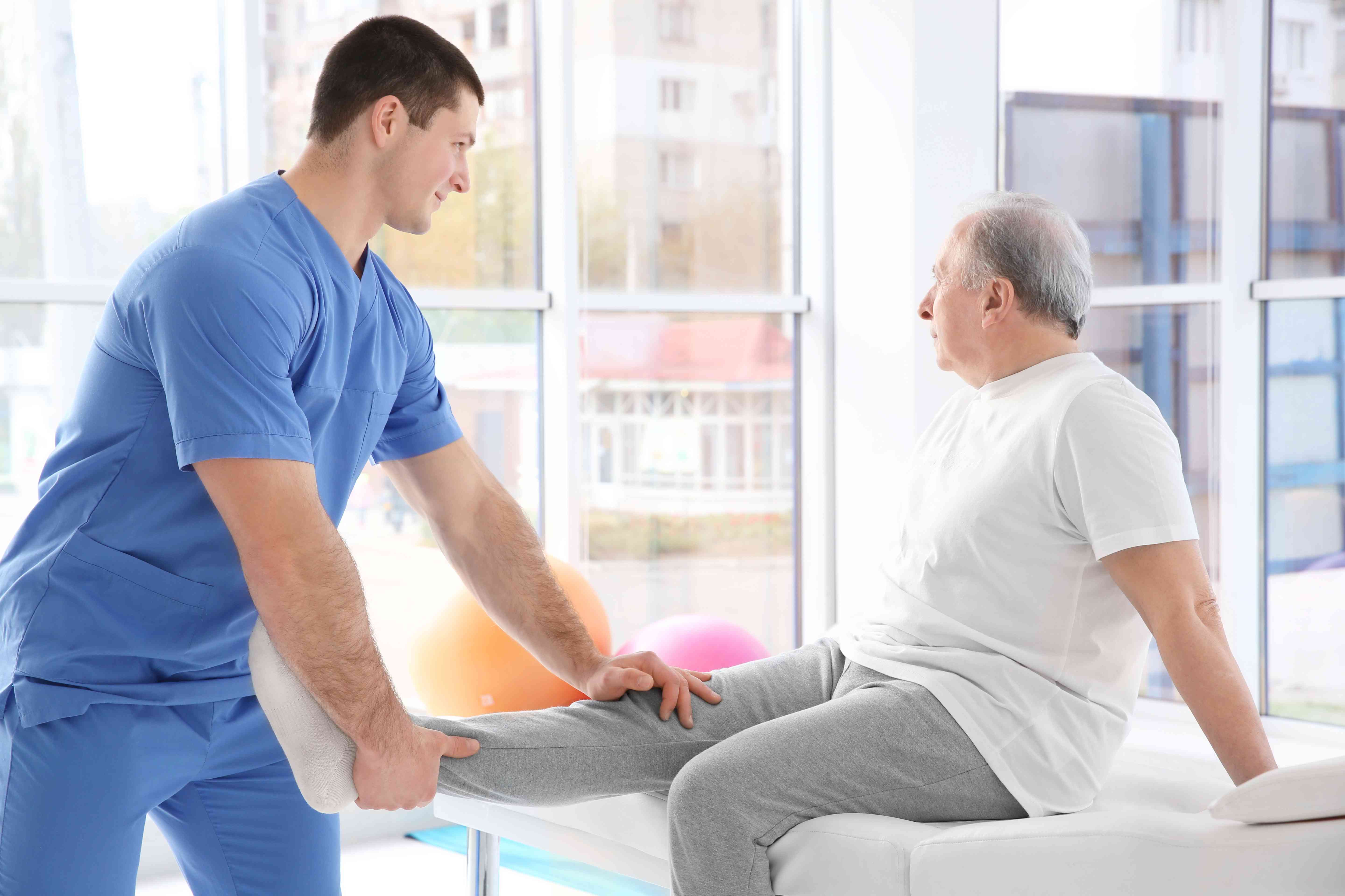 physiotherapist-working-with-elderly-patient-clinic-compressed (1)